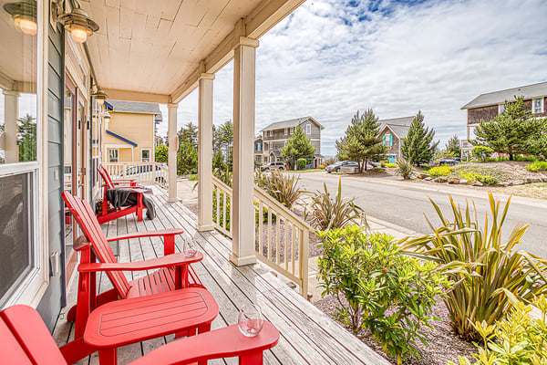 The property sits in a peaceful coastal neighborhood surrounded by lush greenery and charming beach homes, offering a serene setting for your retreat.